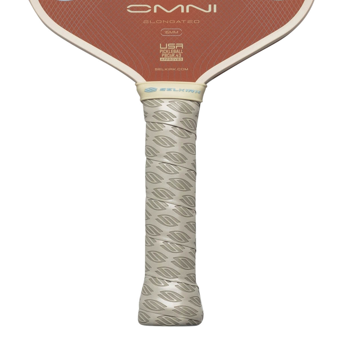Close-up of pickleball paddle grip showing "Selkirk" logo and textured pattern.
