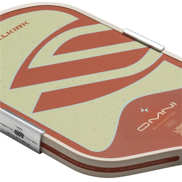 Close-up of a pickleball paddle showing the "OMNI ELONGATED 16MM" logo and "MOI TUNING SYSTEM" text.