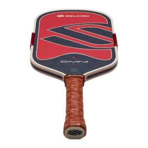 Top-down view of a Selkirk OMNI pickleball paddle with red, white, and blue star design and a textured brown grip.