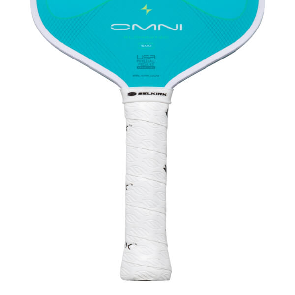 Close-up of a pickleball paddle showing the "OMNI" logo, "15MM" thickness, and the white textured grip with the "SELKIRK" logo.