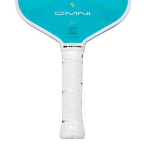 Close-up of a pickleball paddle showing the "OMNI" logo, "15MM" thickness, and the white textured grip with the "SELKIRK" logo.