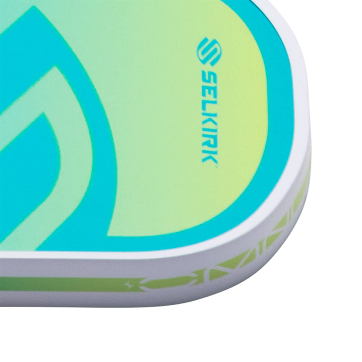 Corner view of a paddle with a blue and green gradient, the Selkirk logo, and a geometric pattern on the edge.
