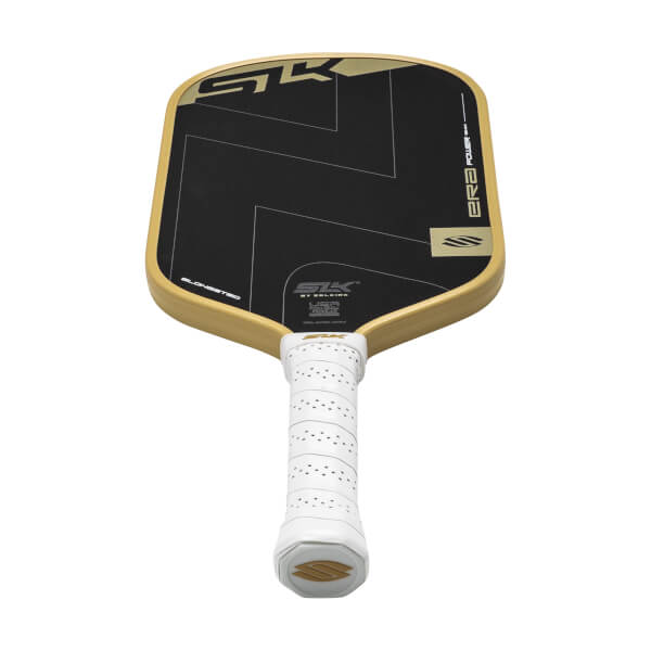 Angled view of a black pickleball paddle with gold SLK logo, gold edge, and a white perforated grip.