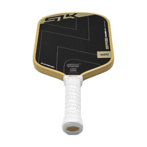 Angled view of a black pickleball paddle with gold SLK logo, gold edge, and a white perforated grip.