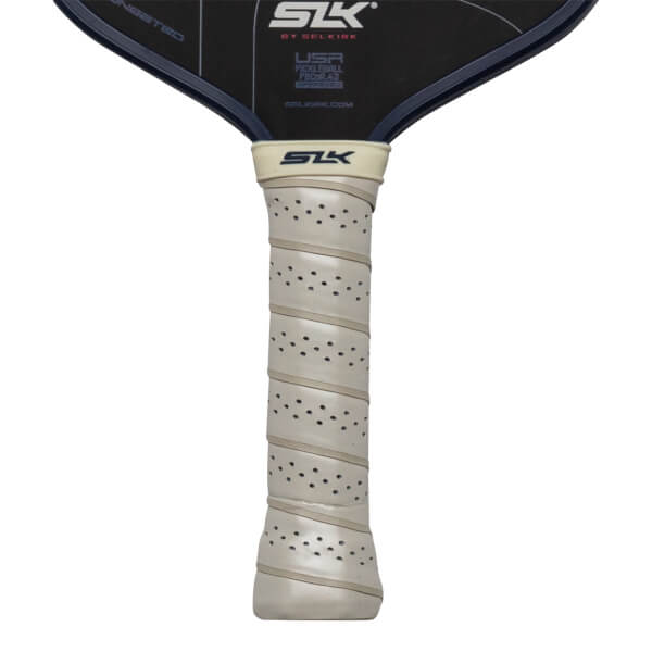 Close-up of a pickleball paddle grip with perforations and the SLK logo.
