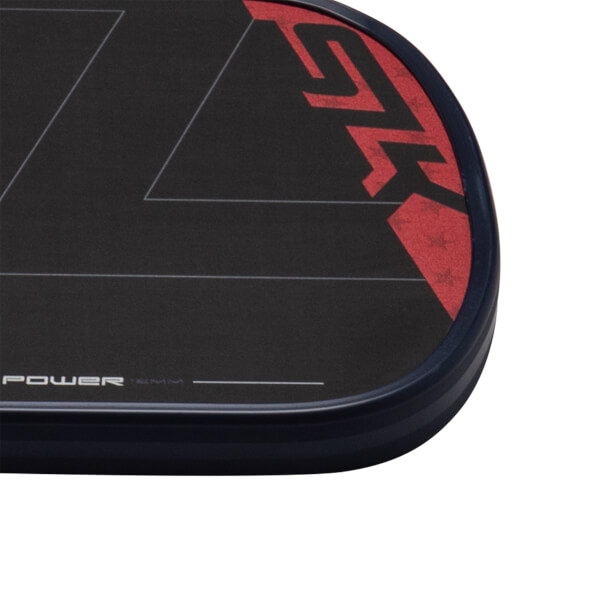 Close-up of the Selkirk SLK ERA paddle showing the red SLK logo and "POWER 16MM" text.