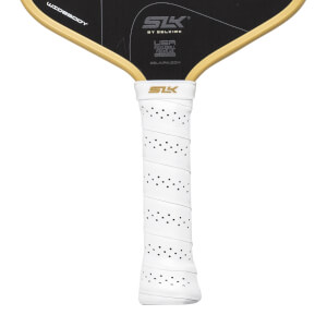 Close-up front view of a black and gold pickleball paddle with a white perforated grip, SLK logo, and WIDEBODY text.