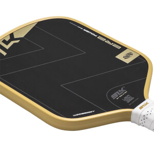 Angled view of a black and gold pickleball paddle with ERA POWER text, SLK logo, and a white perforated grip.