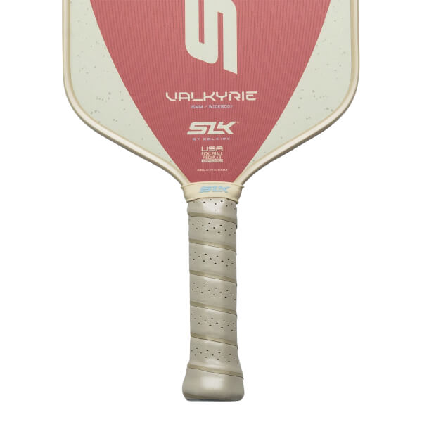 Top-down view of a pickleball paddle with a pink and cream design, featuring "VALKYRIE" and "SLK" logos.