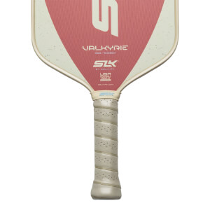 Top-down view of a pickleball paddle with a pink and cream design, featuring "VALKYRIE" and "SLK" logos.