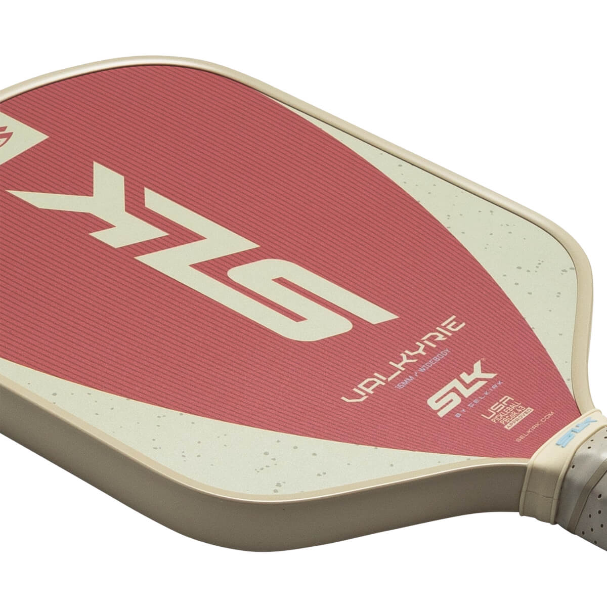Corner view of a pickleball paddle with a red textured surface, a cream-colored border, and "SLK" and "VALKYRIE" text.