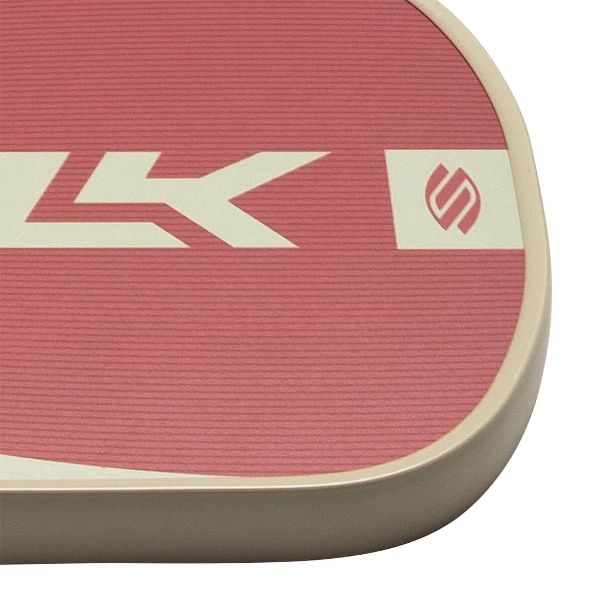 Close-up of a pink paddle with a cream stripe, a stylized "LK" logo, and a circular logo.