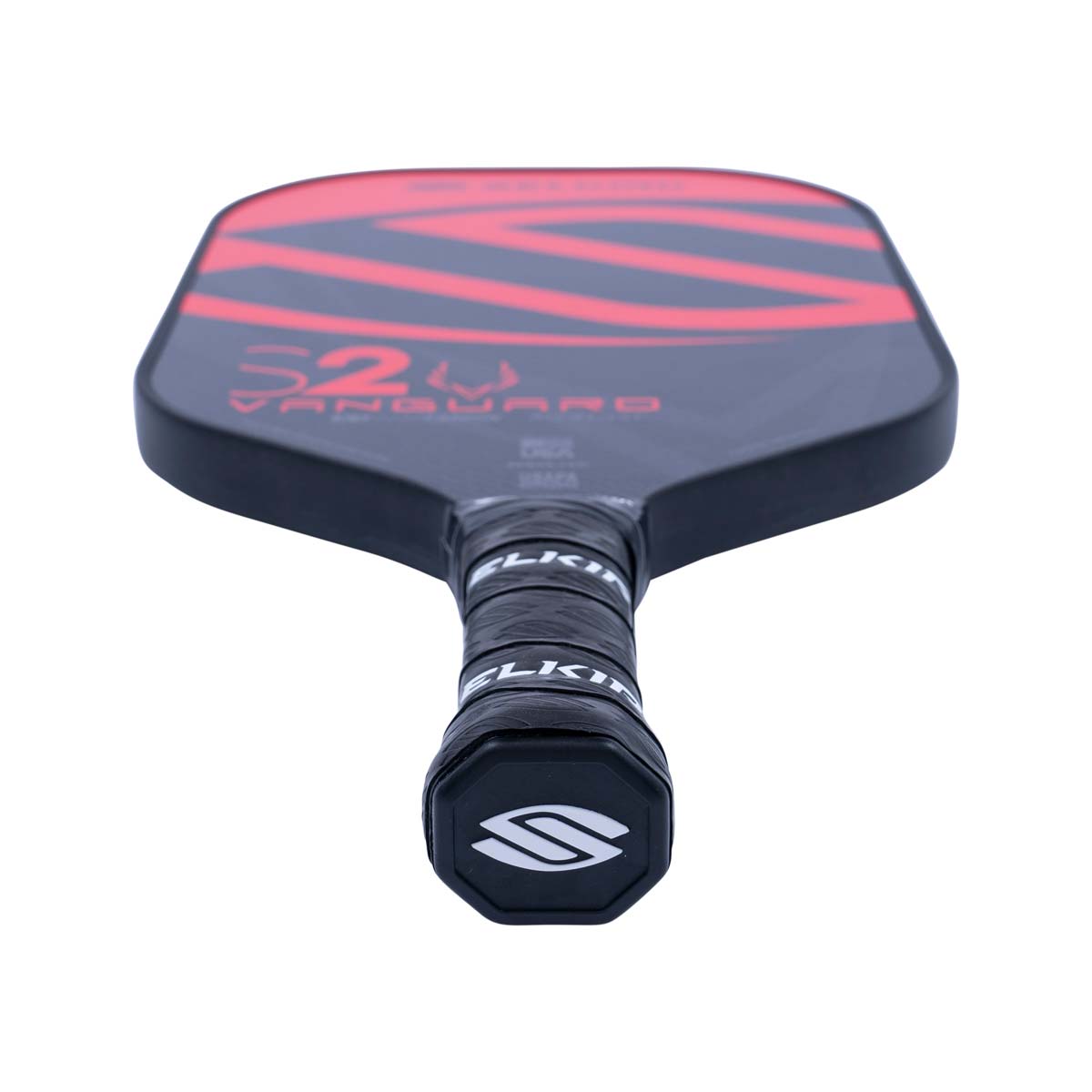 Top-down view of a black pickleball paddle with red S2 VANGUARD graphics and a black grip with white SELKIRK branding.
