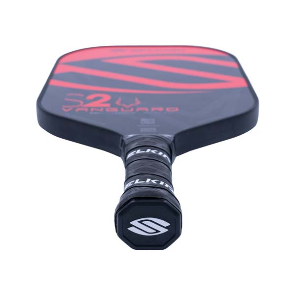 Top-down view of a black pickleball paddle with red S2 VANGUARD graphics and a black grip with white SELKIRK branding.