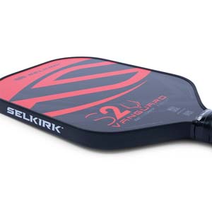 Corner view of a black pickleball paddle with red VANGUARD S2 graphics and SELKIRK branding.