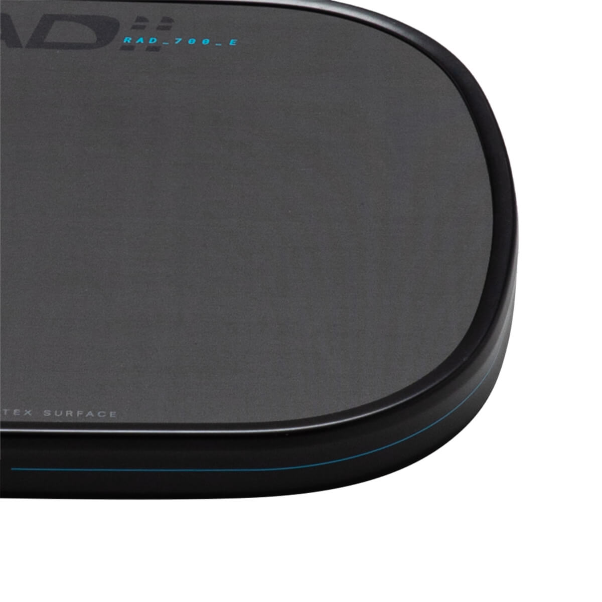 Corner view of a black paddle with "HEAD RAD_700_E" and "TEX SURFACE" text.