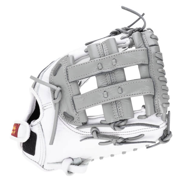 Top-down view of a white and gray baseball glove with visible lacing and a red and gold tag.