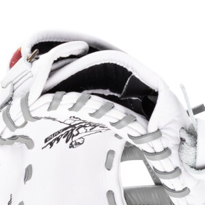 Close-up of a white baseball glove's interior, showing black lining and grey lacing.