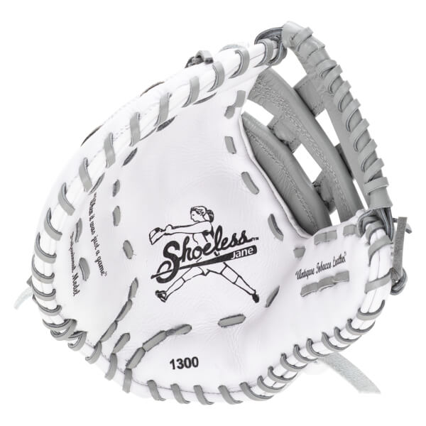 Inside view of a white softball glove with grey lacing, showing the "Shoeless Jane" logo and "1300".
