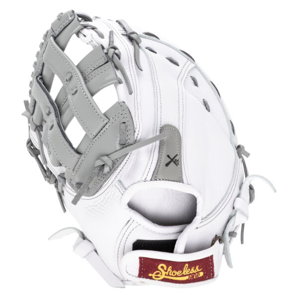 Side view of a white baseball glove with gray lacing and a maroon tag with "Shoeless" embroidered in gold.