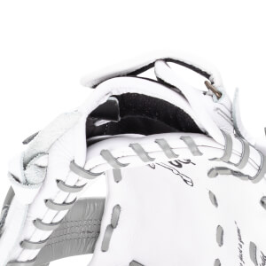 Close-up of a white baseball glove showing grey lacing, a metal ring, and the words "just a game".