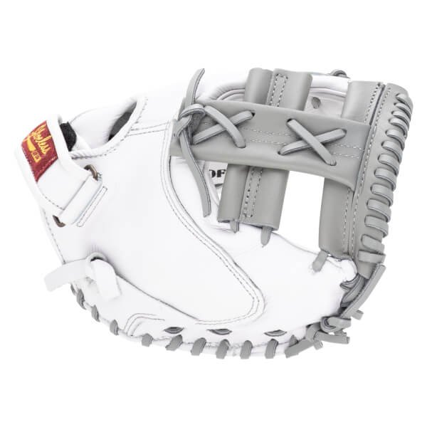 Side view of a white baseball glove with grey lacing and a red "Shoeless" tag.