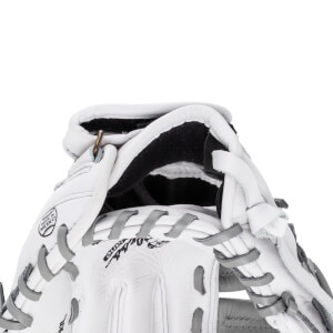 Close-up view of the white leather wrist opening featuring gray laces, a small brass ring, and the "Shoeless Jane" brand name with a "MADE IN MEXICO" stamp.