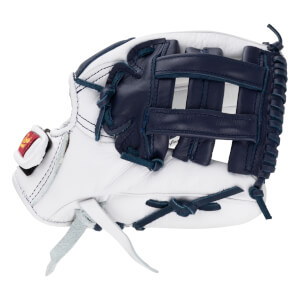 Side view of the white and navy blue leather softball glove featuring a dark blue web and a red brand logo patch on the thumb.