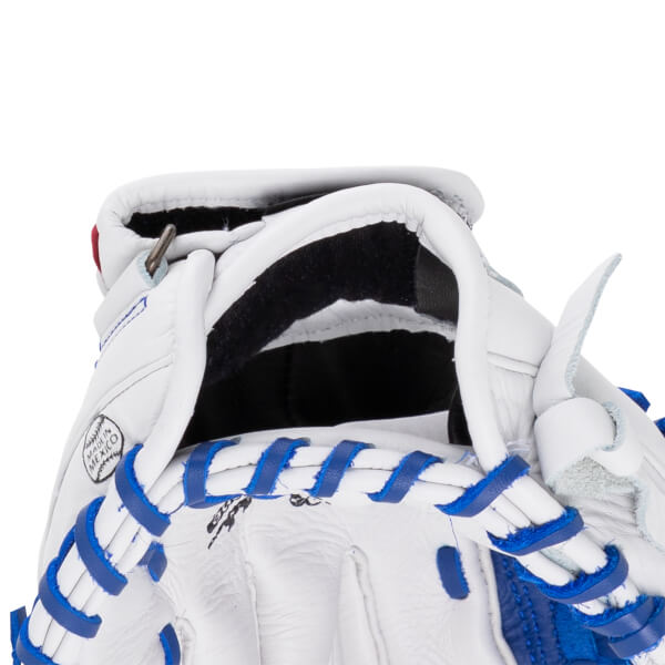 Close-up view of the white leather wrist opening featuring blue laces, black interior padding, and a circular stamp that says "MADE IN MEXICO".