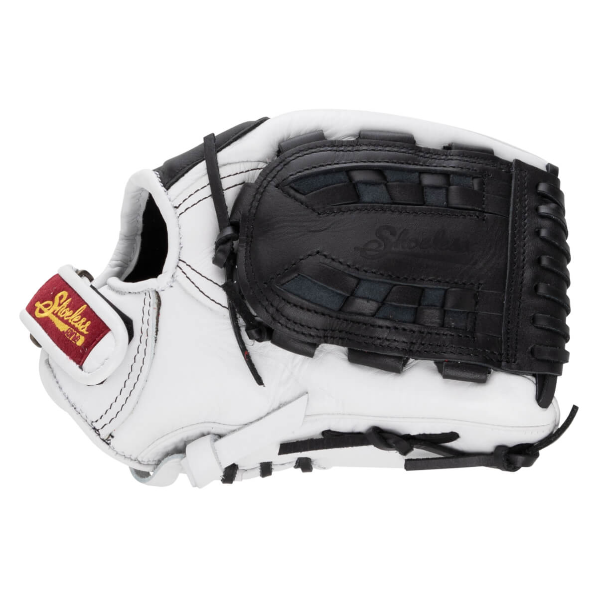 Back view of a white and black softball glove featuring a closed web embossed with "Shoeless" and a red wrist strap label with "Shoeless" in gold script.