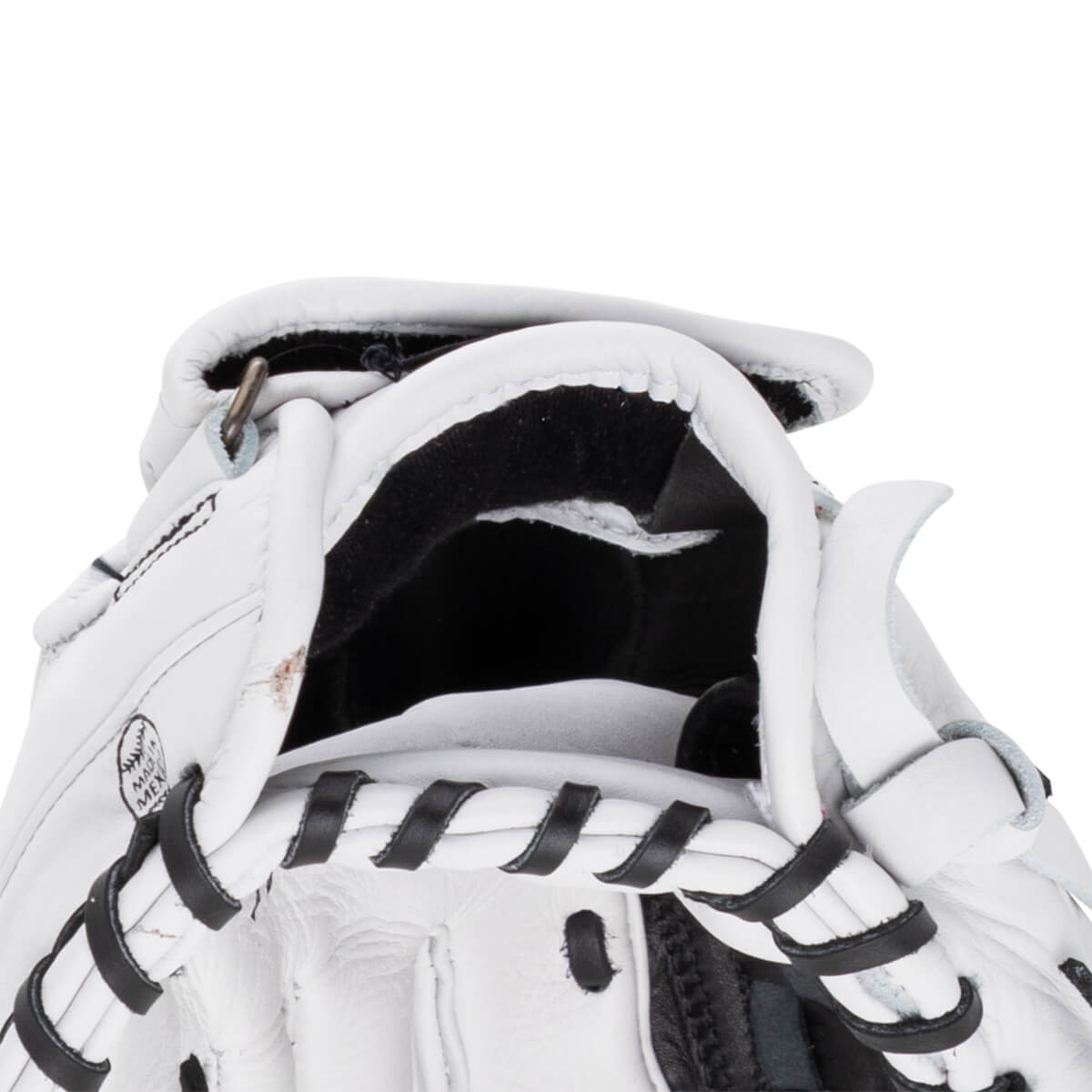 Close-up of the wrist opening on this white Shoeless Jane glove featuring black laces, black lining, and a "MADE IN MEXICO" stamp on the leather.