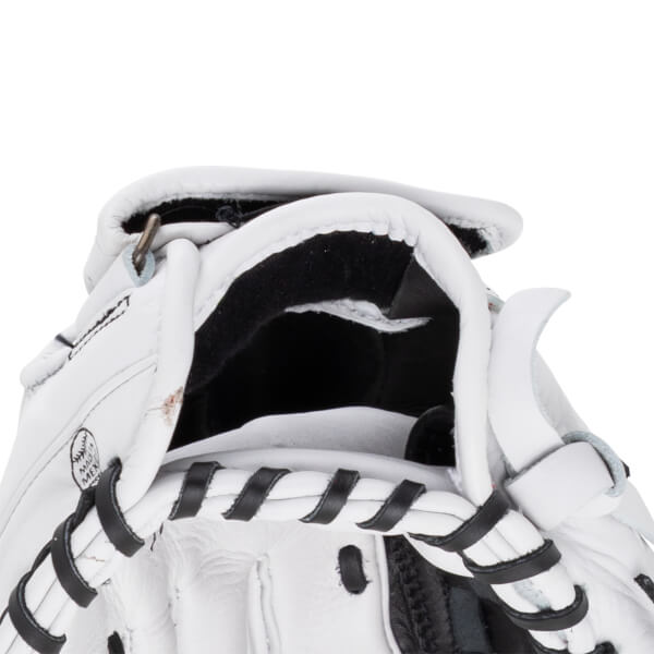 Close-up of the wrist opening on this white Shoeless Jane glove featuring black laces, black lining, and a "MADE IN MEXICO" stamp on the leather.