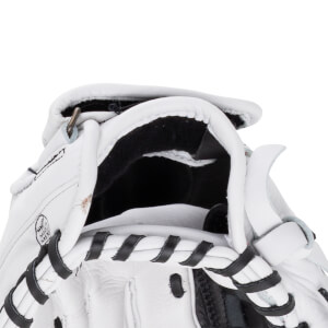 Close-up of the wrist opening on this white Shoeless Jane glove featuring black laces, black lining, and a "MADE IN MEXICO" stamp on the leather.