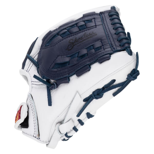 Back view of a white leather softball glove with navy blue laces and a basket web featuring the embossed "Shoeless" brand name.