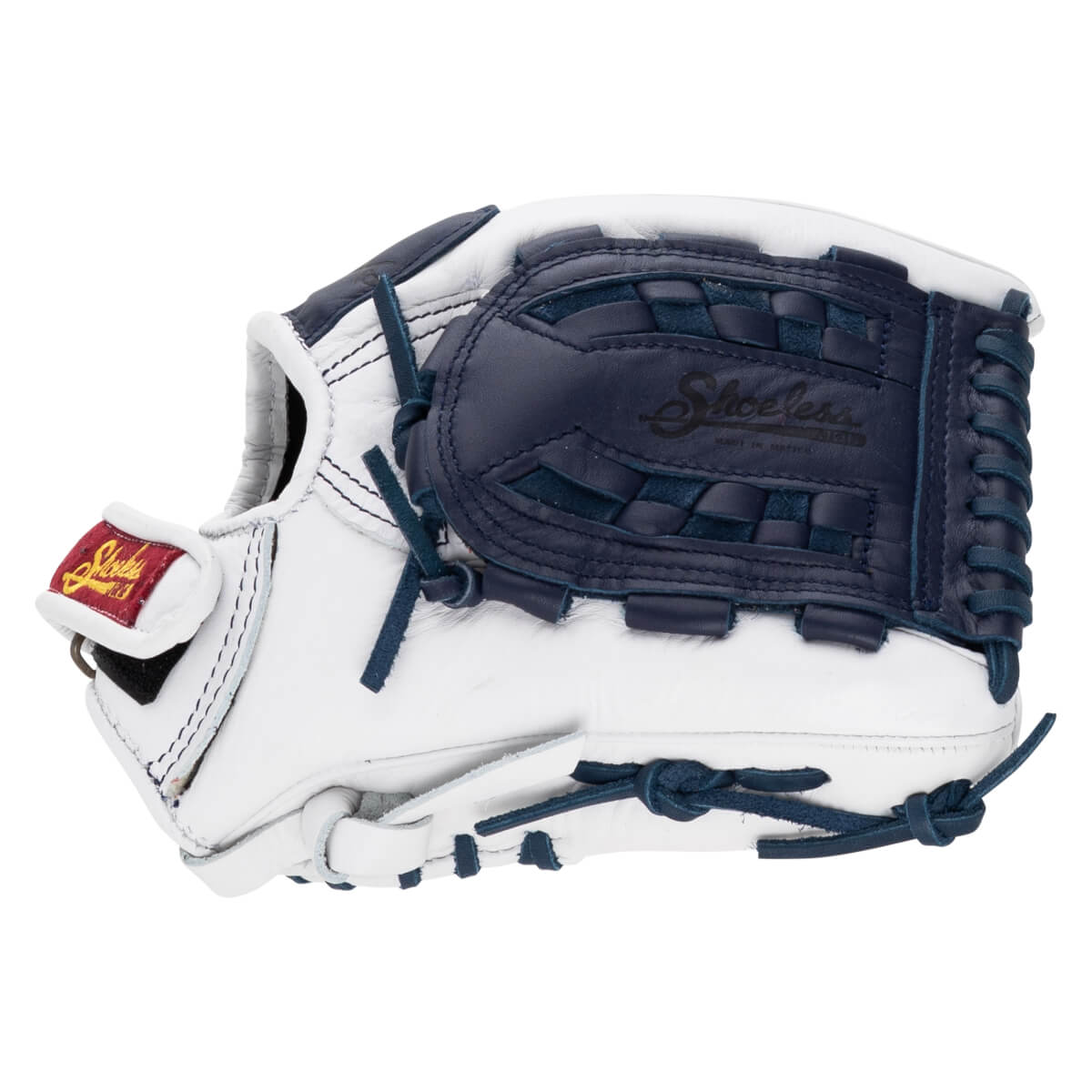 Back view of a white leather fastpitch softball glove featuring a navy blue basket weave web stamped with “Shoeless” and a red and gold brand patch.