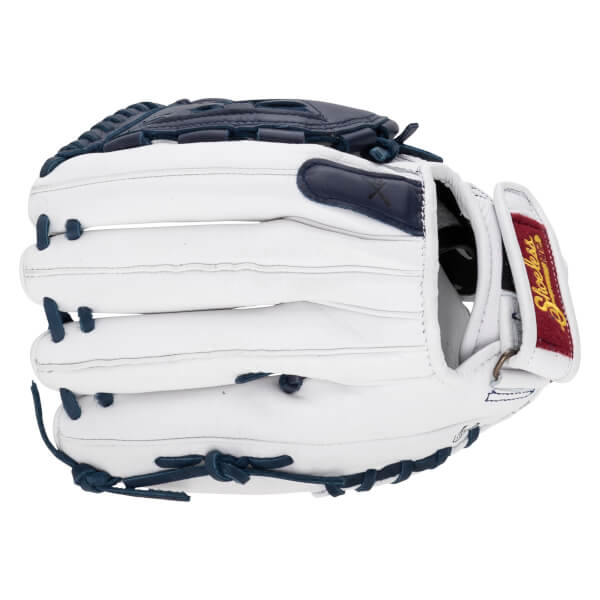 Back view of a white fastpitch glove with navy blue accents and laces, featuring a red wrist label with the Shoeless Joe brand name.