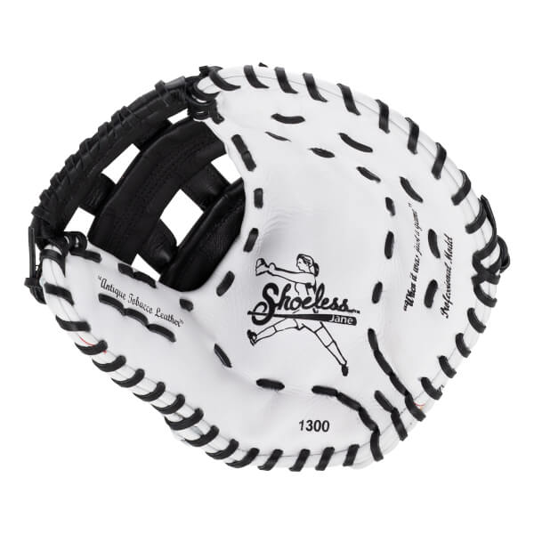 Palm view of the white leather first base mitt featuring black lacing, the Shoeless Jane logo, and "Antique Tobacco Leather" text.
