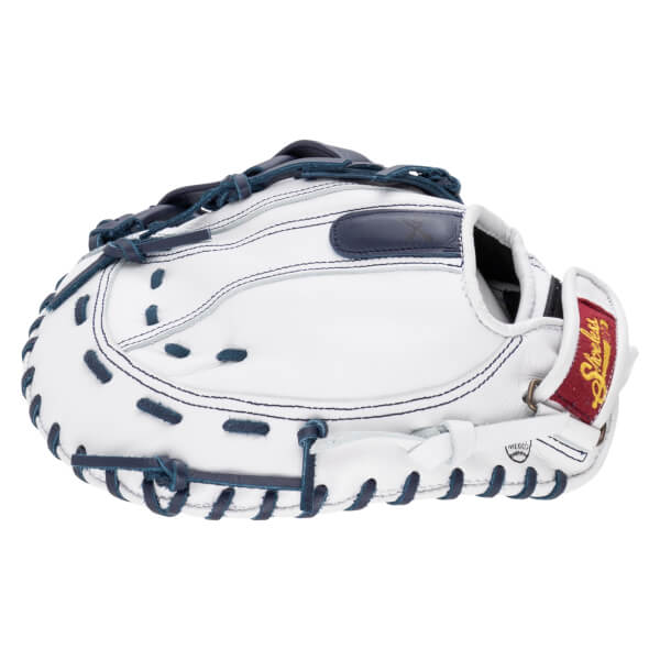 Back view of a white leather catcher's mitt with navy blue laces and a maroon wrist strap featuring "Shoeless Joe" in gold script.