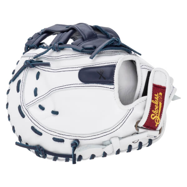 Back view of a white leather catcher's mitt featuring navy blue laces and a red wrist strap patch with the gold Shoeless Joe logo.