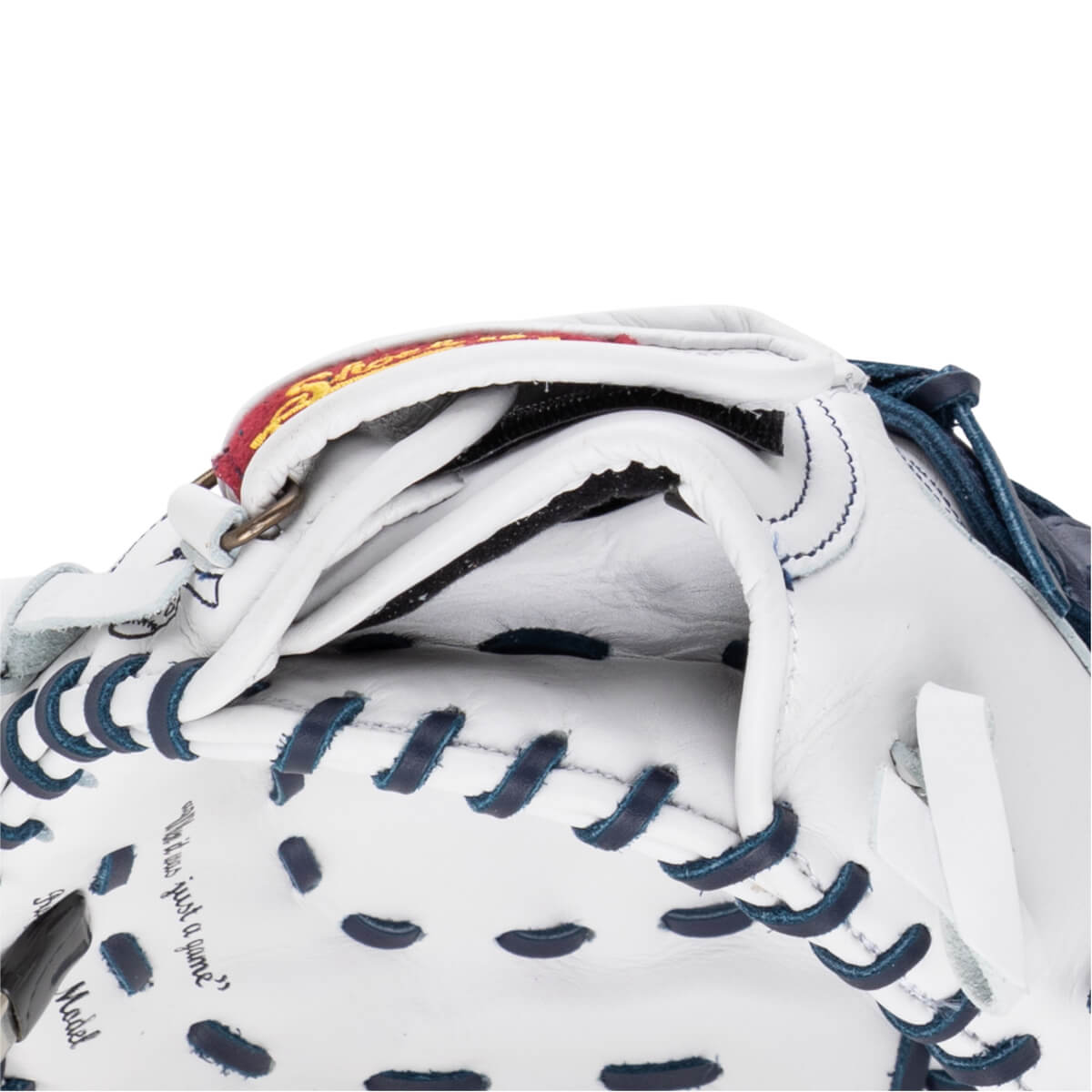 Close-up of the white leather baseball glove's adjustable wrist opening featuring navy blue lacing and text that reads, "What if it was just a game?"
