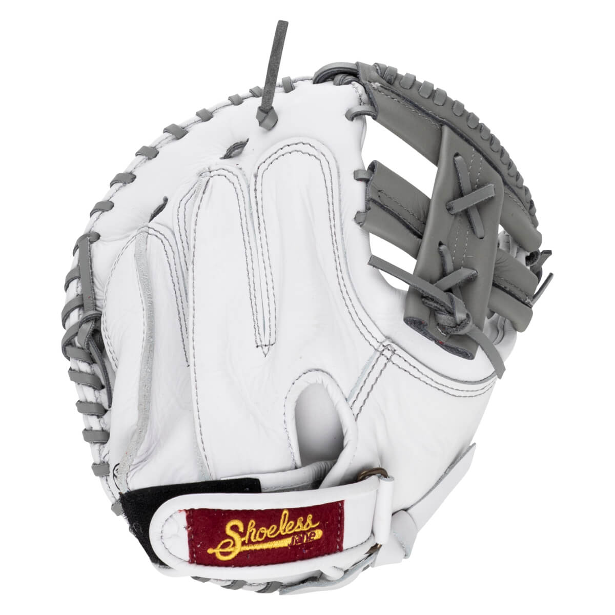 Back view of a white leather first base mitt with grey laces and a maroon "Shoeless Jane" brand patch on the adjustable wrist strap.
