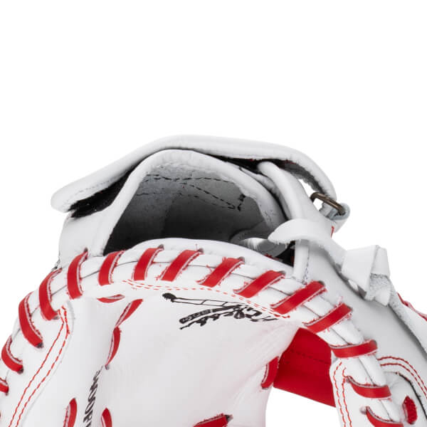 Close-up view of the white leather catcher's mitt pocket edge and thumb opening, featuring red laces and a partial Shoeless Jane logo.