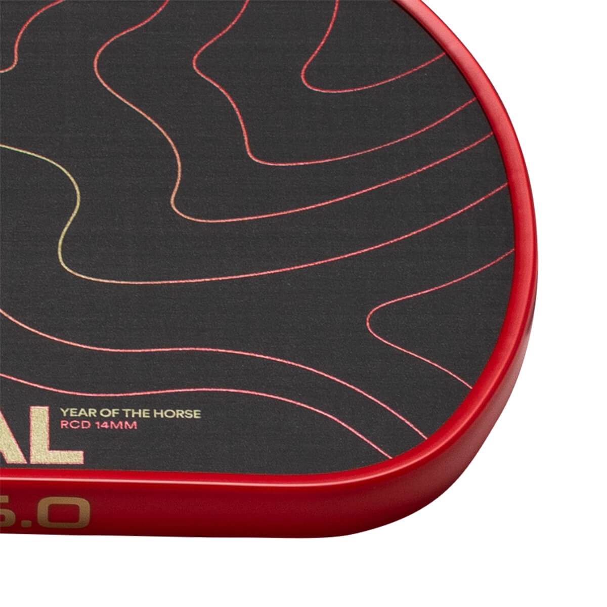 Close-up of a black pickleball paddle face with red edge guard, red/yellow wavy lines, and YEAR OF THE HORSE text.