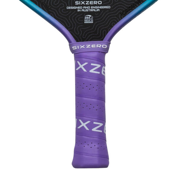 Close-up of a purple pickleball paddle grip with "SIX ZERO" and "XZ8" visible.