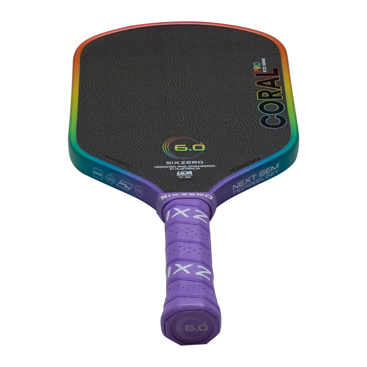 Front view of a Six Zero Coral paddle with a rainbow edge, showing "CORAL PRO" and "NEXT GEM TECHNOLOGY".