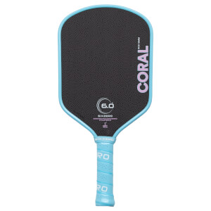 Front view of a Six Zero Coral pickleball paddle featuring a black face with a grey topographic pattern and a light blue edge guard and grip.