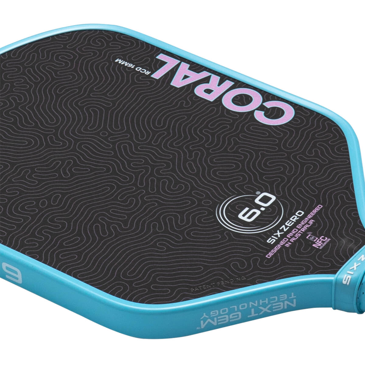Angled close-up of the Coral 6.0 pickleball paddle showing pink topographic patterns on a black face and a light blue rim with Next Gen Technology text.
