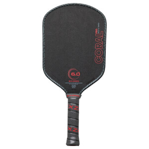 Front view of a black pickleball paddle with "CORAL PRO RCD-E 16MM" in red, a "6.0" graphic, and "SIX ZERO" branding.