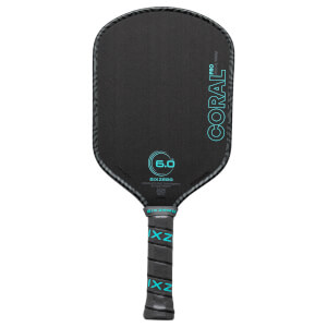 Front view of a black pickleball paddle with "CORAL PRO" and "6.0" in teal text, and "SIXZERO" on the grip.