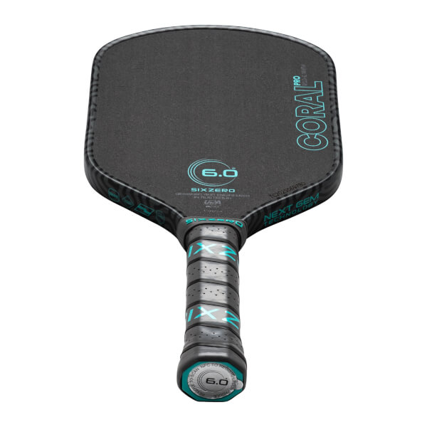 Top-down view of a black pickleball paddle with "CORAL PRO" and "SIXZERO" text, and a "6.0" logo.